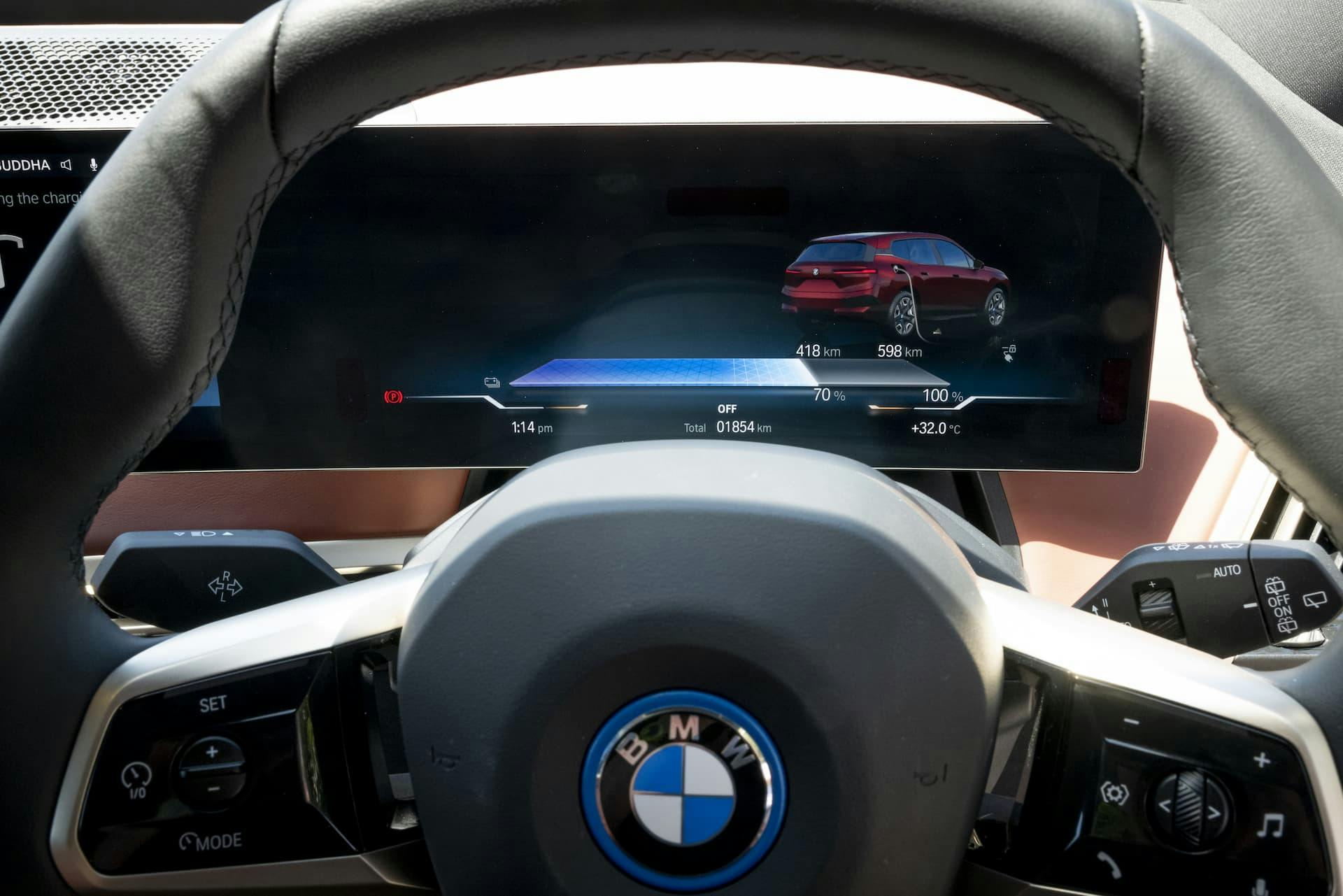 BMW iX driver's instrument cluster EV charging screen