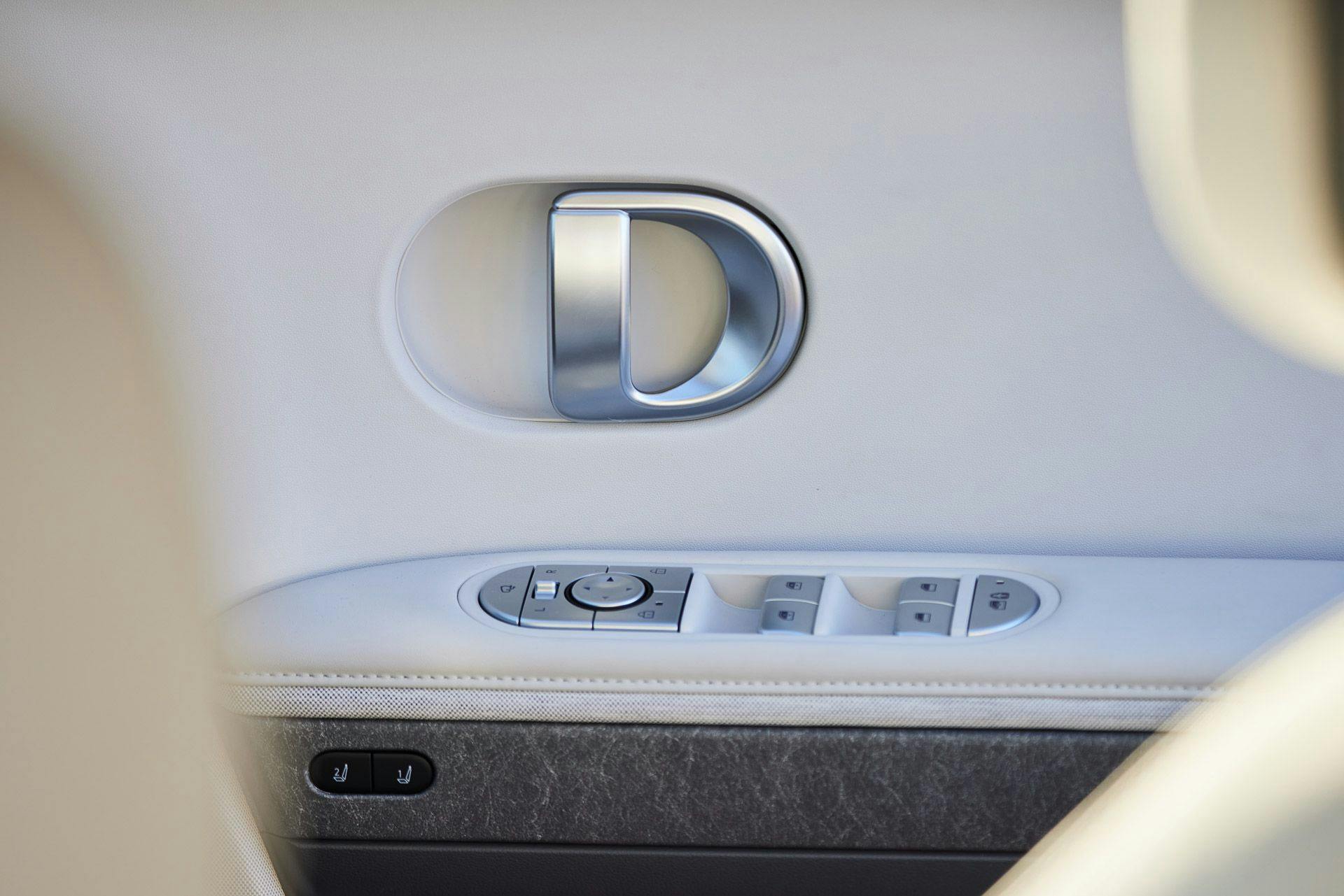 Hyundai Ioniq 5 white interior door handle and window switches