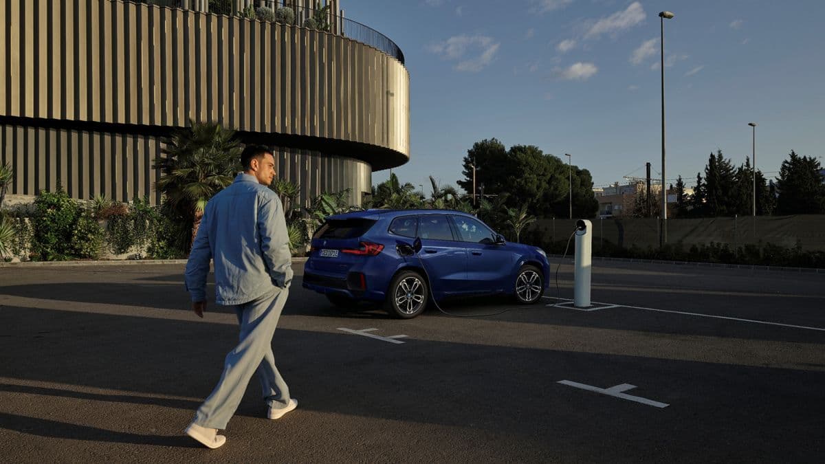Man walking to electric car Man walking to electric car