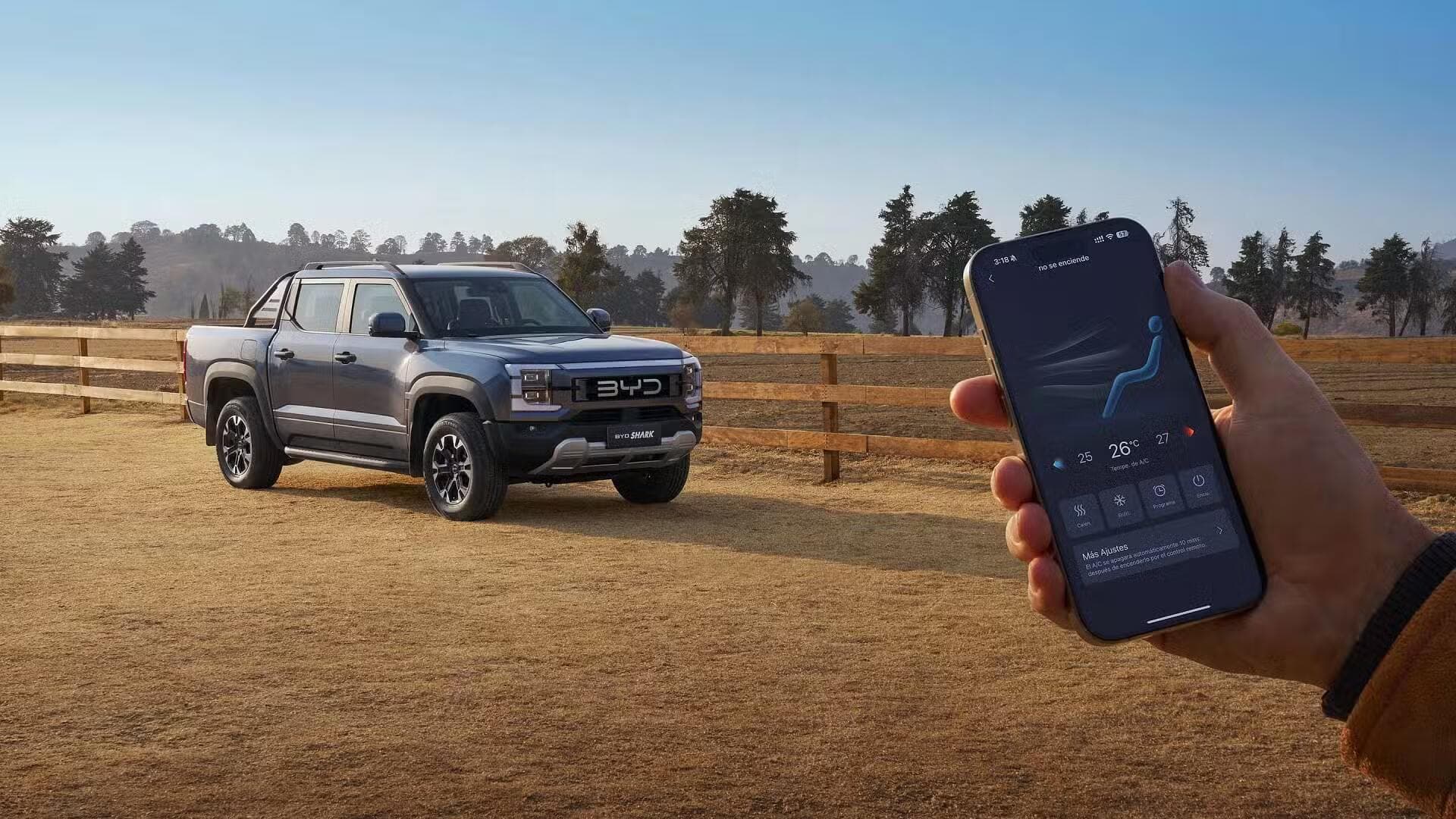 BYD Shark 6 Ute on road with phone at foreground BYD Shark 6 Ute on road with phone at foreground