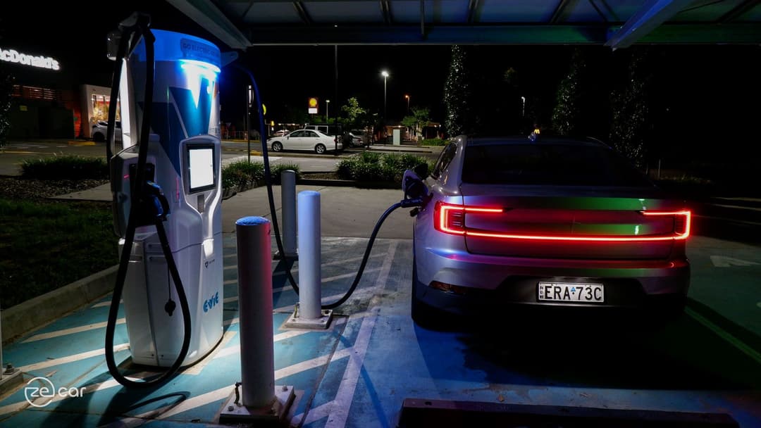 Polestar 2 charging plug and rear at night