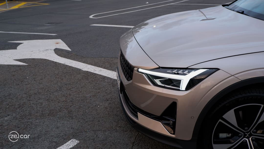 Polestar 2 front light and man driving