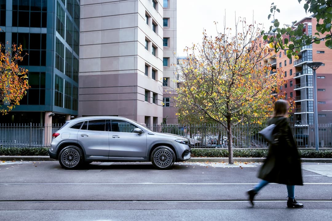 Mercedes-Benz EQA side view at city street Mercedes-Benz EQA side view at city street