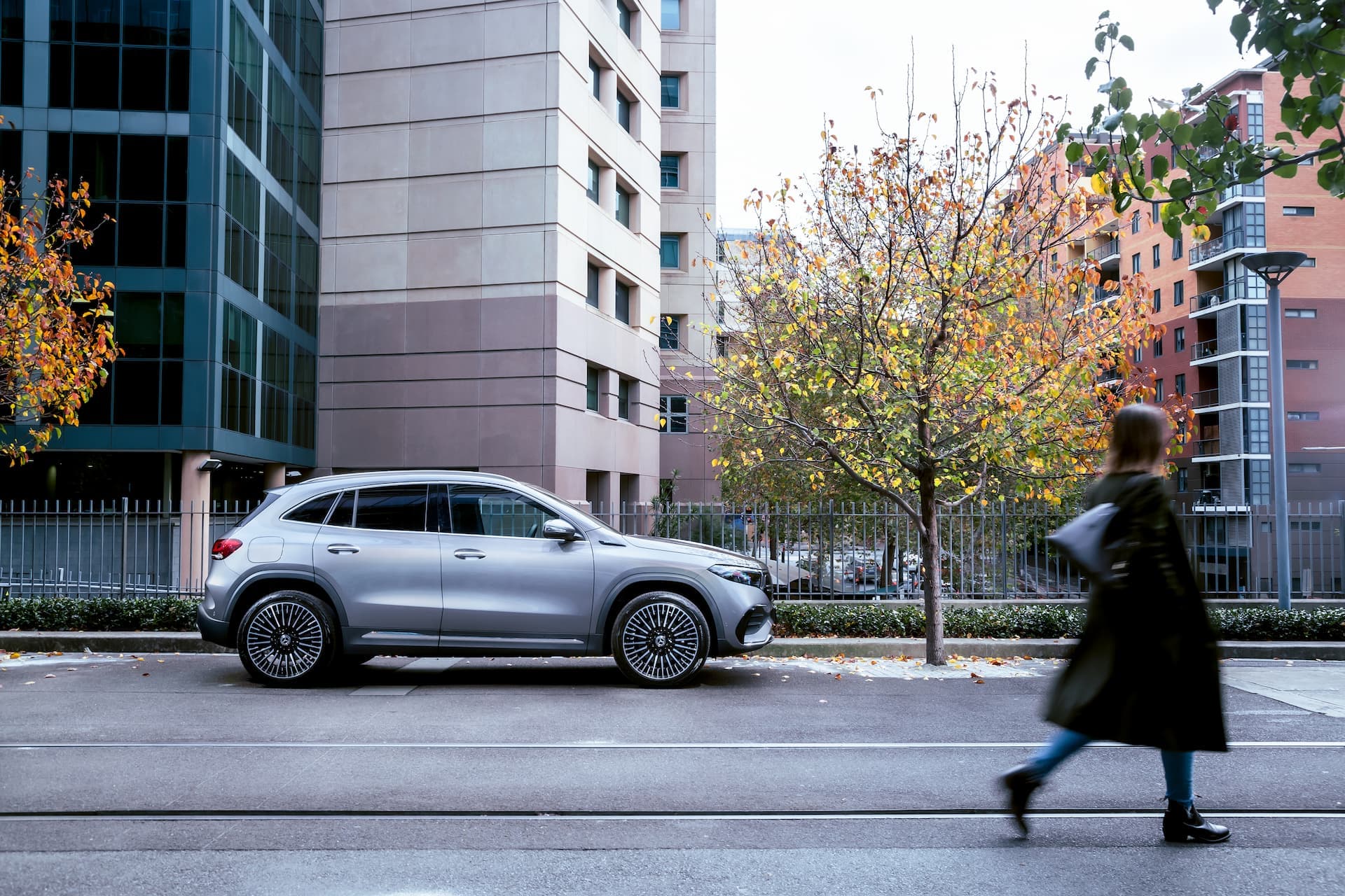 Mercedes-Benz EQA side view at city street Mercedes-Benz EQA side view at city street