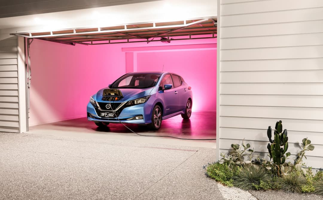 Nissan Leaf e+ plugged in garage using vehicle-to-home technology Nissan Leaf e+ plugged in garage using vehicle-to-home technology
