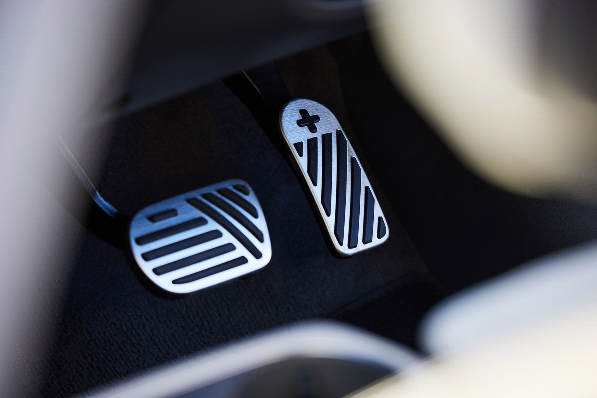 Hyundai Ioniq 5 brake and accelerator pedals with minus and plus signs Hyundai Ioniq 5 brake and accelerator pedals with minus and plus signs