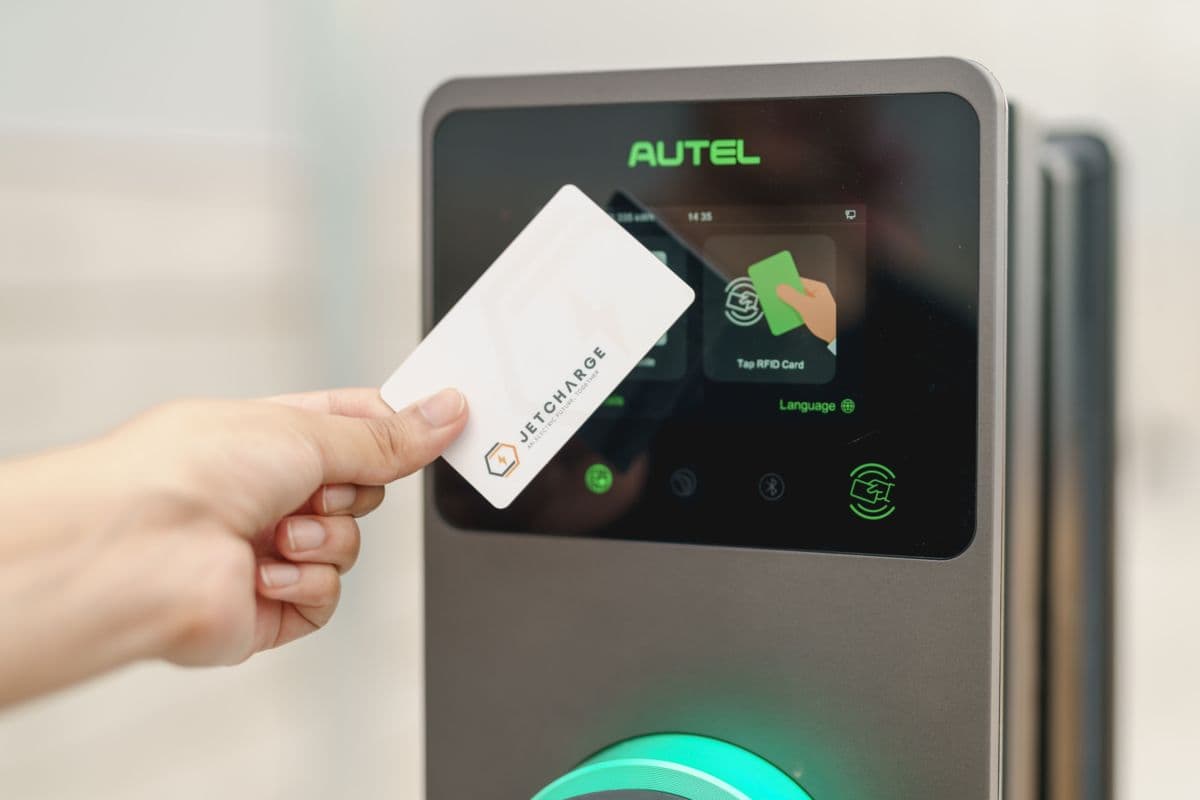 Driver tapping an RFID card on an Autel commercial EV charger Driver tapping an RFID card on an Autel commercial EV charger