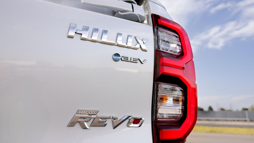 Electric Toyota HiLux in white zoomed in on tail light Electric Toyota HiLux in white zoomed in on tail light