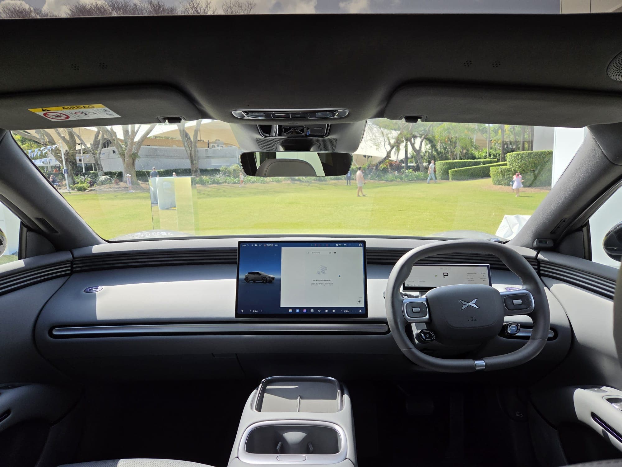 XPeng L03 interior showing the dashboard and 15.6-inch central touchscreen XPeng L03 interior showing the dashboard and 15.6-inch central touchscreen