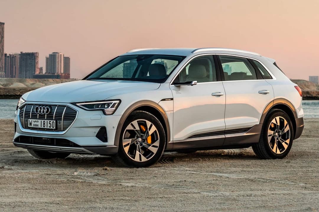 Audi e-Tron white three quarter view sunset background Audi e-Tron white three quarter view sunset background