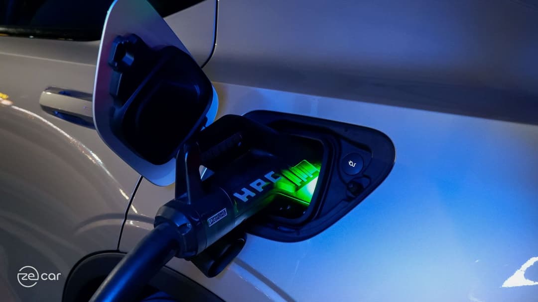 Polestar 2 charging plug and rear at night