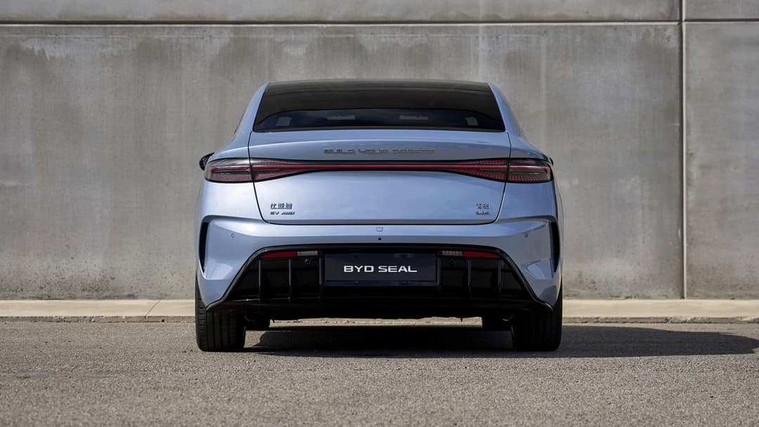 BYD Seal rear view parked with concrete wall background BYD Seal rear view parked with concrete wall background