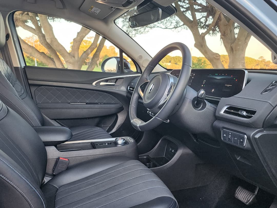 GWM Ora interior showing blue-stitched faux leather seats GWM Ora interior showing blue-stitched faux leather seats