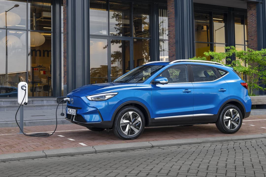 Blue MG ZS EV charging at wallbox Blue MG ZS EV charging at wallbox