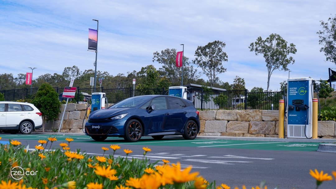 Cupra Born at charging station and rear Cupra logo