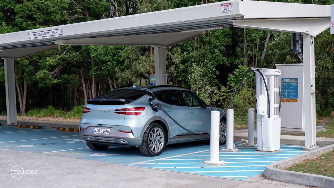 Genesis GV60 AWD plugged-in at public charging station Genesis GV60 AWD plugged-in at public charging station