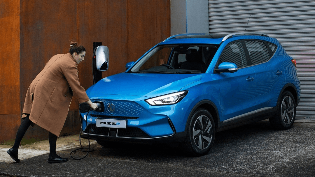 woman charging her own ev woman charging her own ev