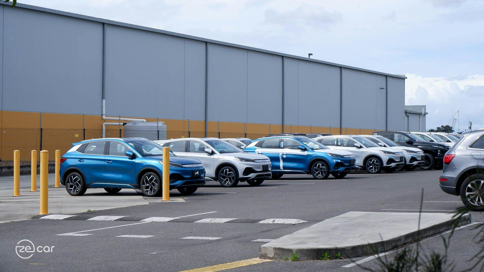 Blue and white BYD Atto 3s in delivery centre