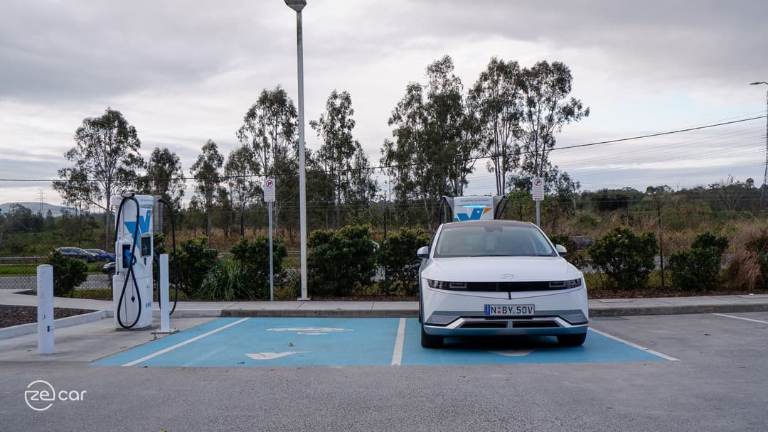 White Hyundai Ioniq 5 charging at Evie Networks charging station White Hyundai Ioniq 5 charging at Evie Networks charging station