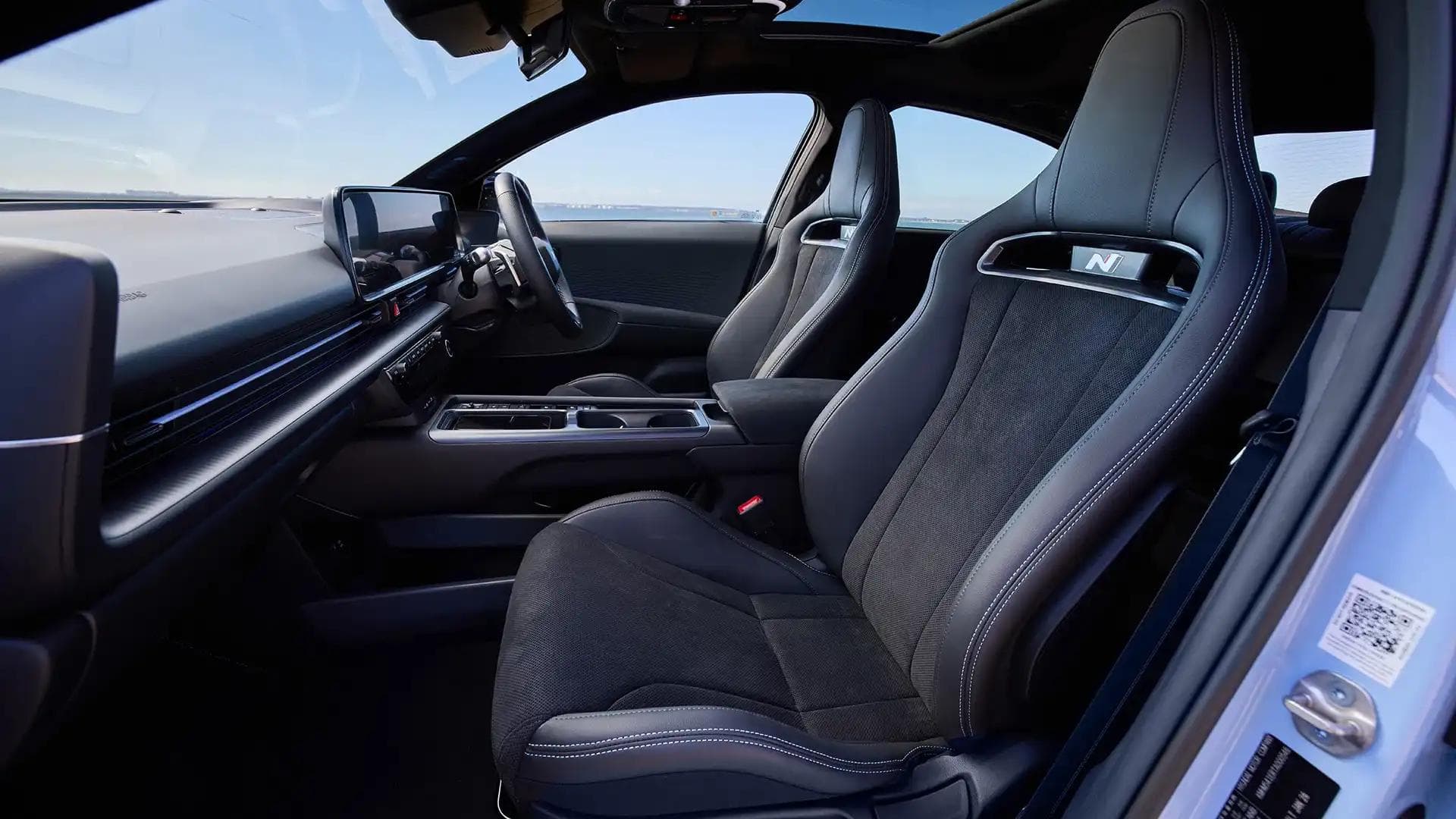Hyundai Ioniq 6 N interior showing N sports seats, N Pasubio steering wheel and digital dashboard Hyundai Ioniq 6 N interior showing N sports seats, N Pasubio steering wheel and digital dashboard