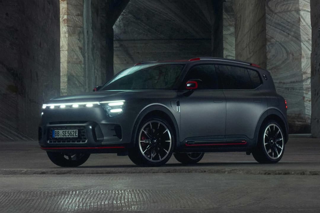 Smart #5 electric SUV in silver parked on a coastal road with ocean views in the background Smart #5 electric SUV in silver parked on a coastal road with ocean views in the background