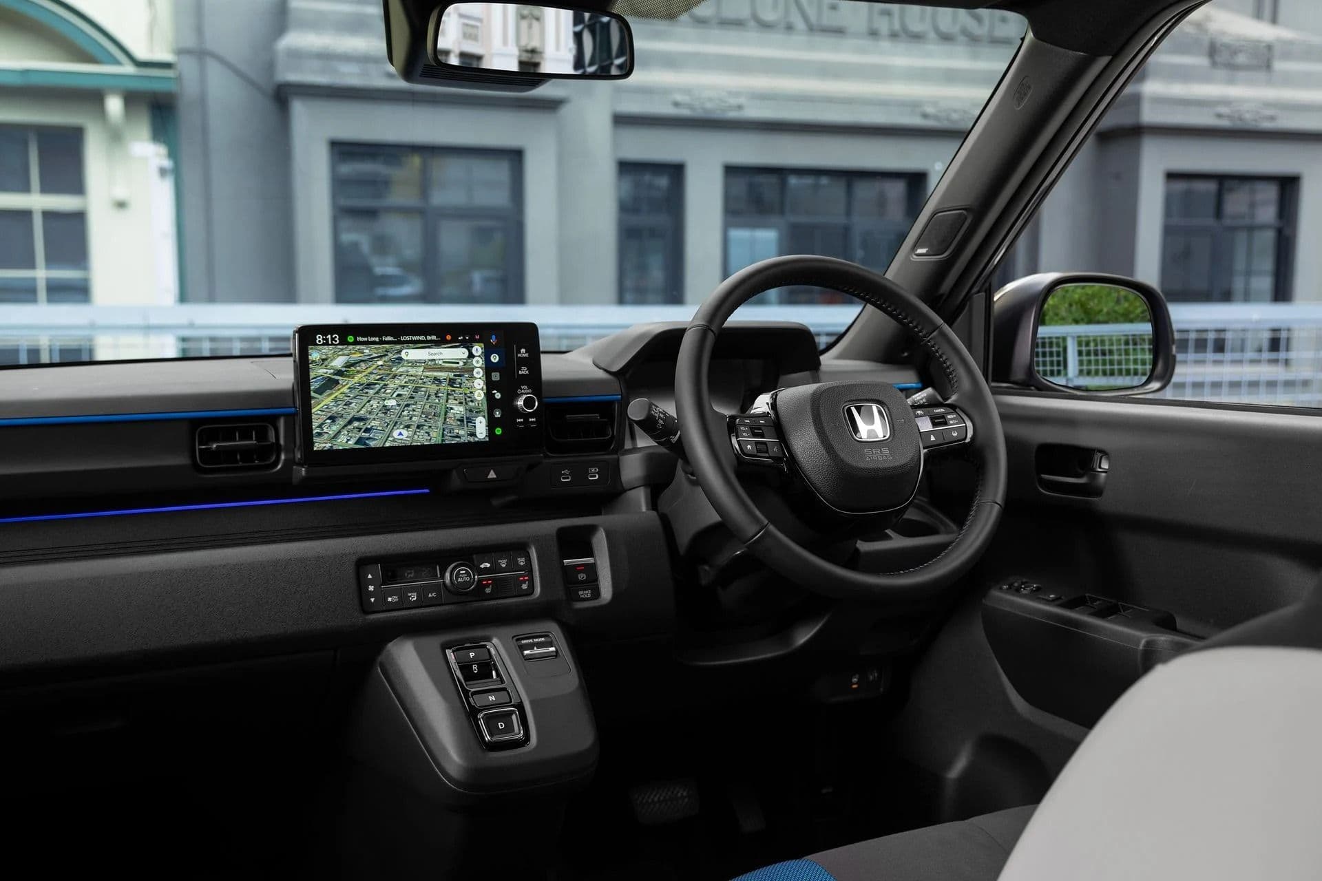 Honda Super-One interior showing the dashboard, steering wheel and touchscreen infotainment display Honda Super-One interior showing the dashboard, steering wheel and touchscreen infotainment display