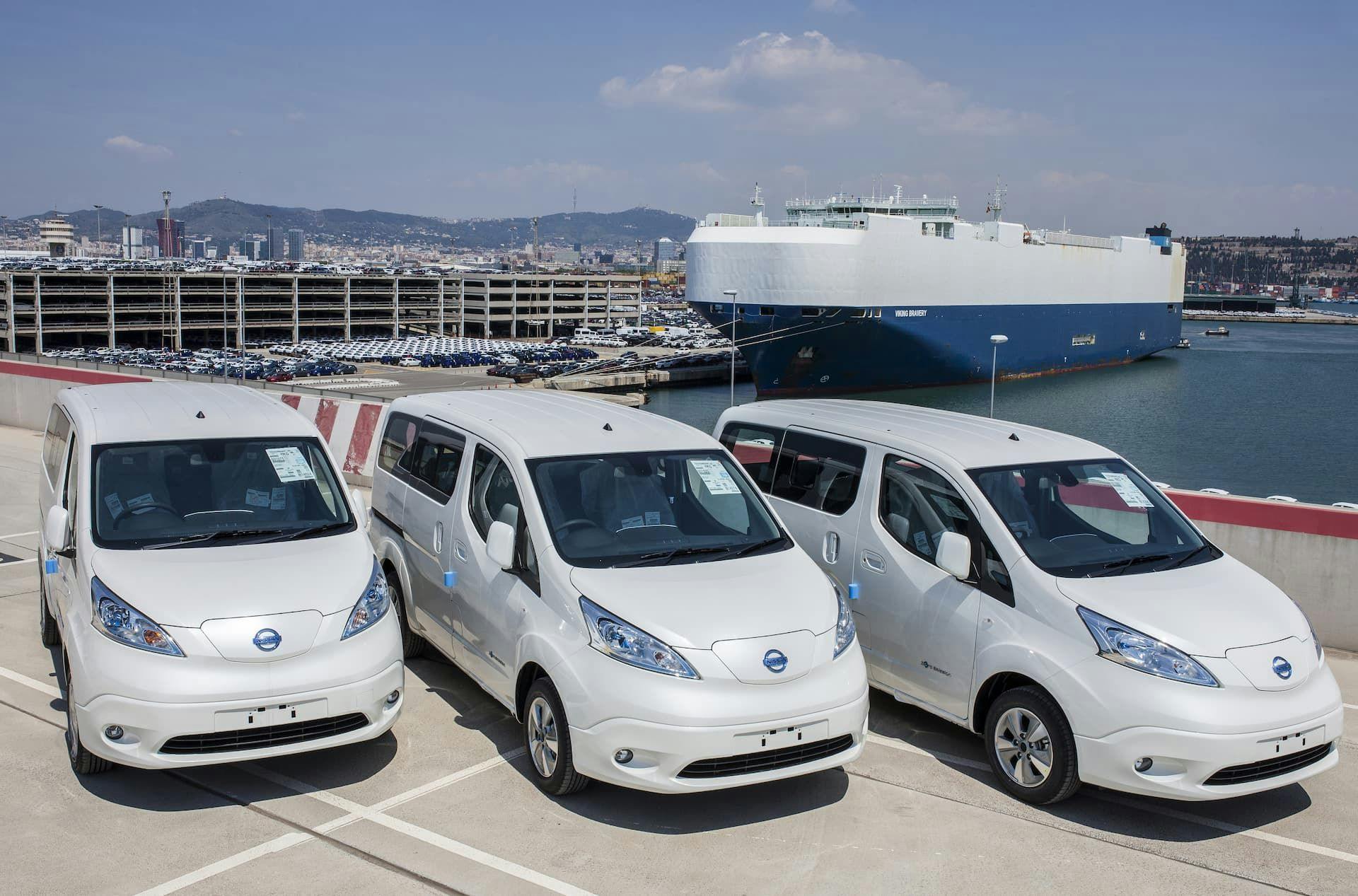 Nissan e-NV200 white vans at shipping port