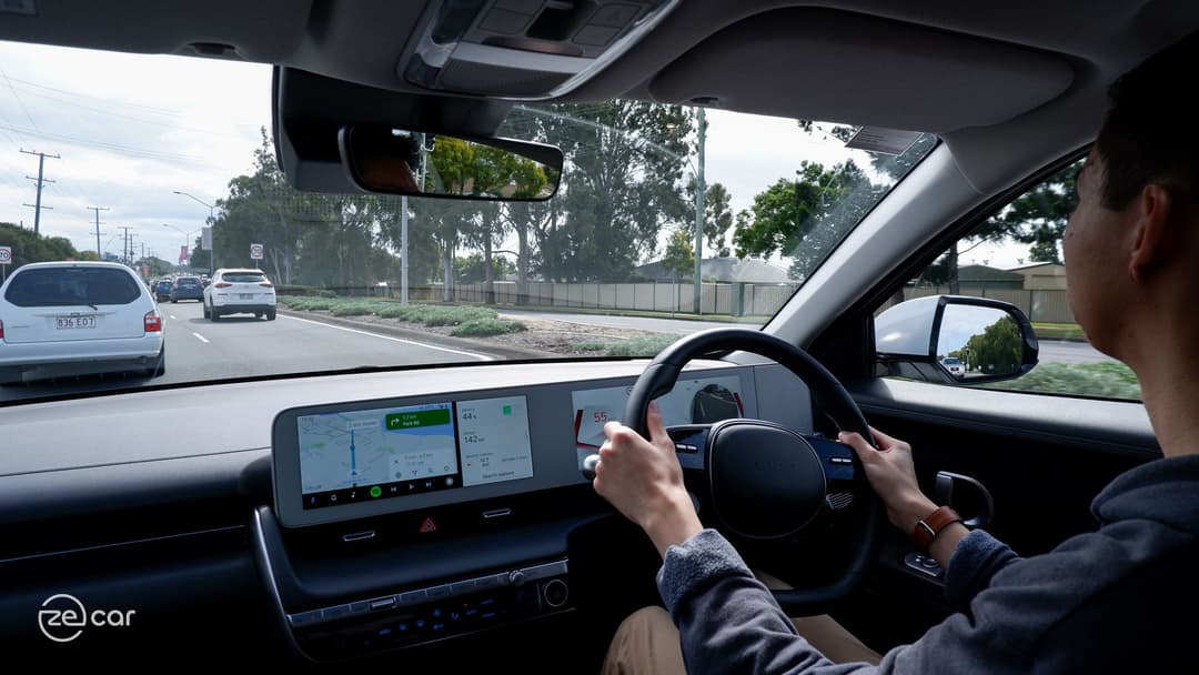 Man driving Hyundai Ioniq 5 and changing lanes Man driving Hyundai Ioniq 5 and changing lanes