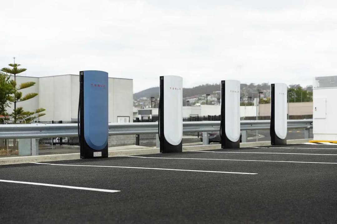 Close-up of Tesla Supercharger No 75,000 plaque showing 2012 to 2025 timeline Close-up of Tesla Supercharger No 75,000 plaque showing 2012 to 2025 timeline