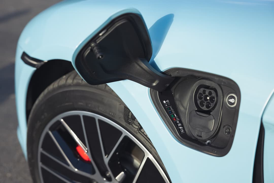 Blue Porsche Taycan EV charging port Blue Porsche Taycan EV charging port