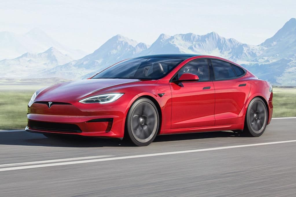 Red Tesla Model S Plaid on the road Red Tesla Model S Plaid on the road