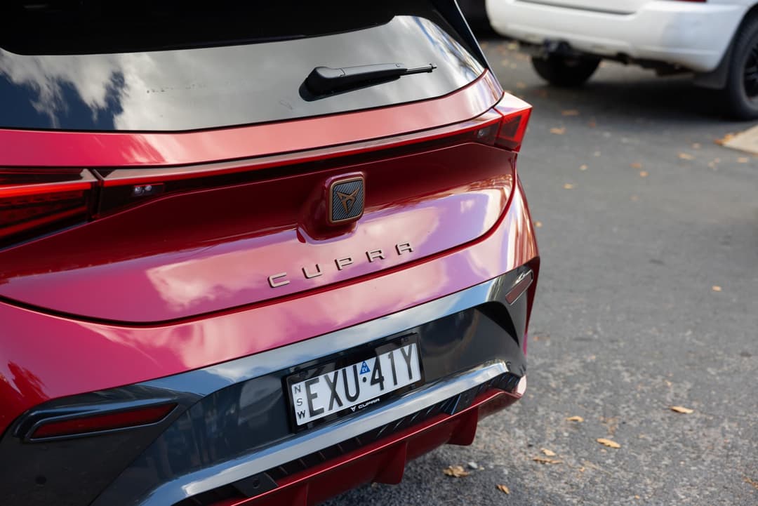 Rayleigh Red Cupra Born rear tailgate with copper Cupra logo and lettering Rayleigh Red Cupra Born rear tailgate with copper Cupra logo and lettering