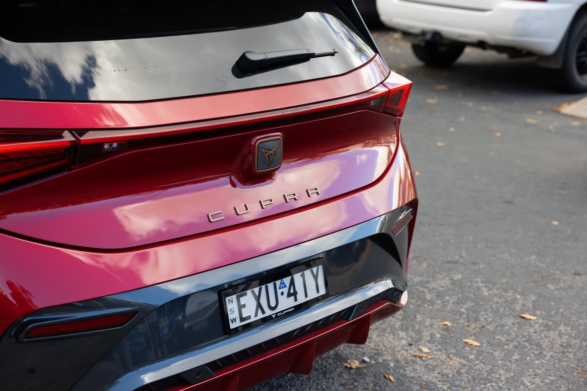 Rayleigh Red Cupra Born rear tailgate with copper Cupra logo and lettering Rayleigh Red Cupra Born rear tailgate with copper Cupra logo and lettering