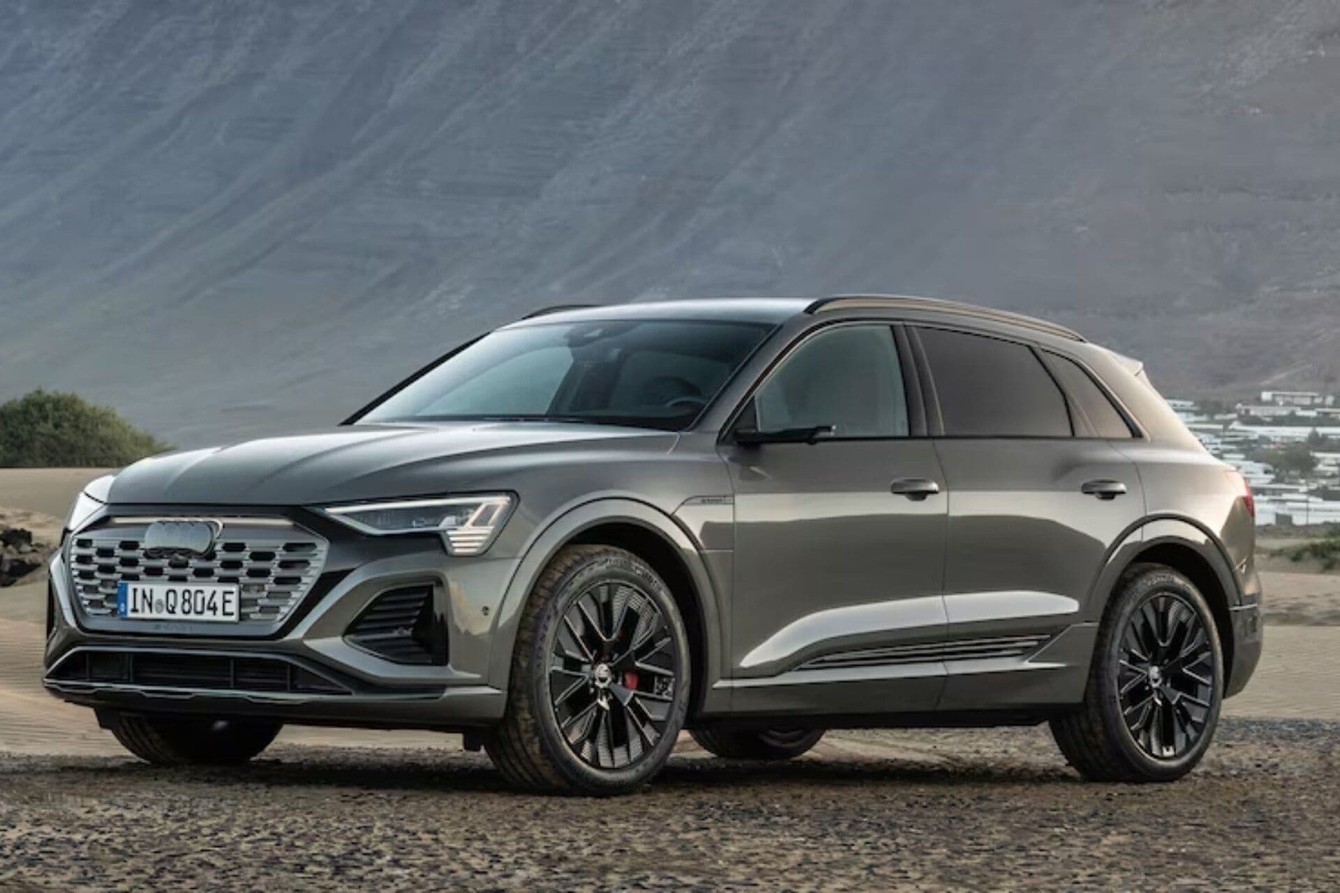 Audi Q8 50 e-Tron with mountain background Audi Q8 50 e-Tron with mountain background