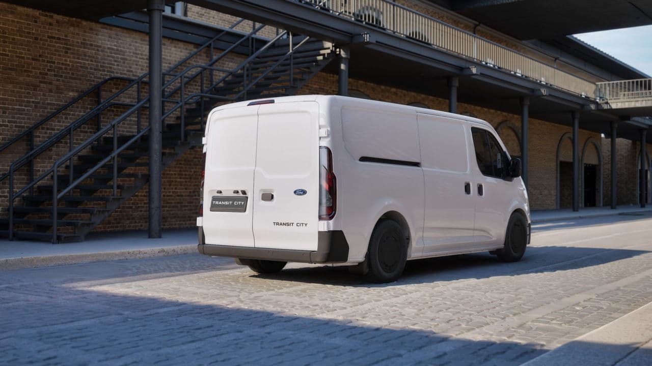 Ford Transit City electric van in white, rear three-quarter view Ford Transit City electric van in white, rear three-quarter view