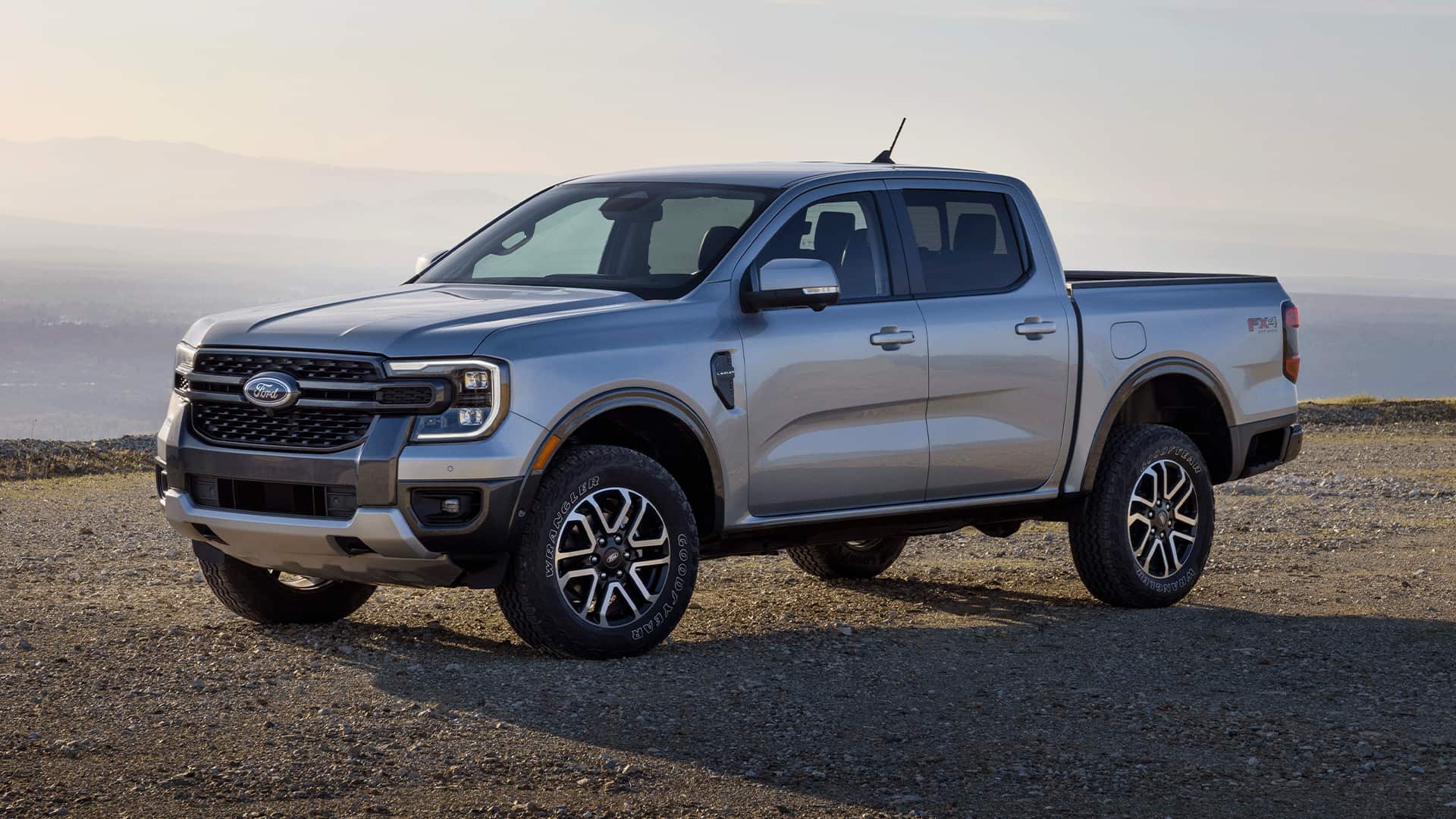 Grey Ford Ranger on off-road with the sea at the background Grey Ford Ranger on off-road with the sea at the background