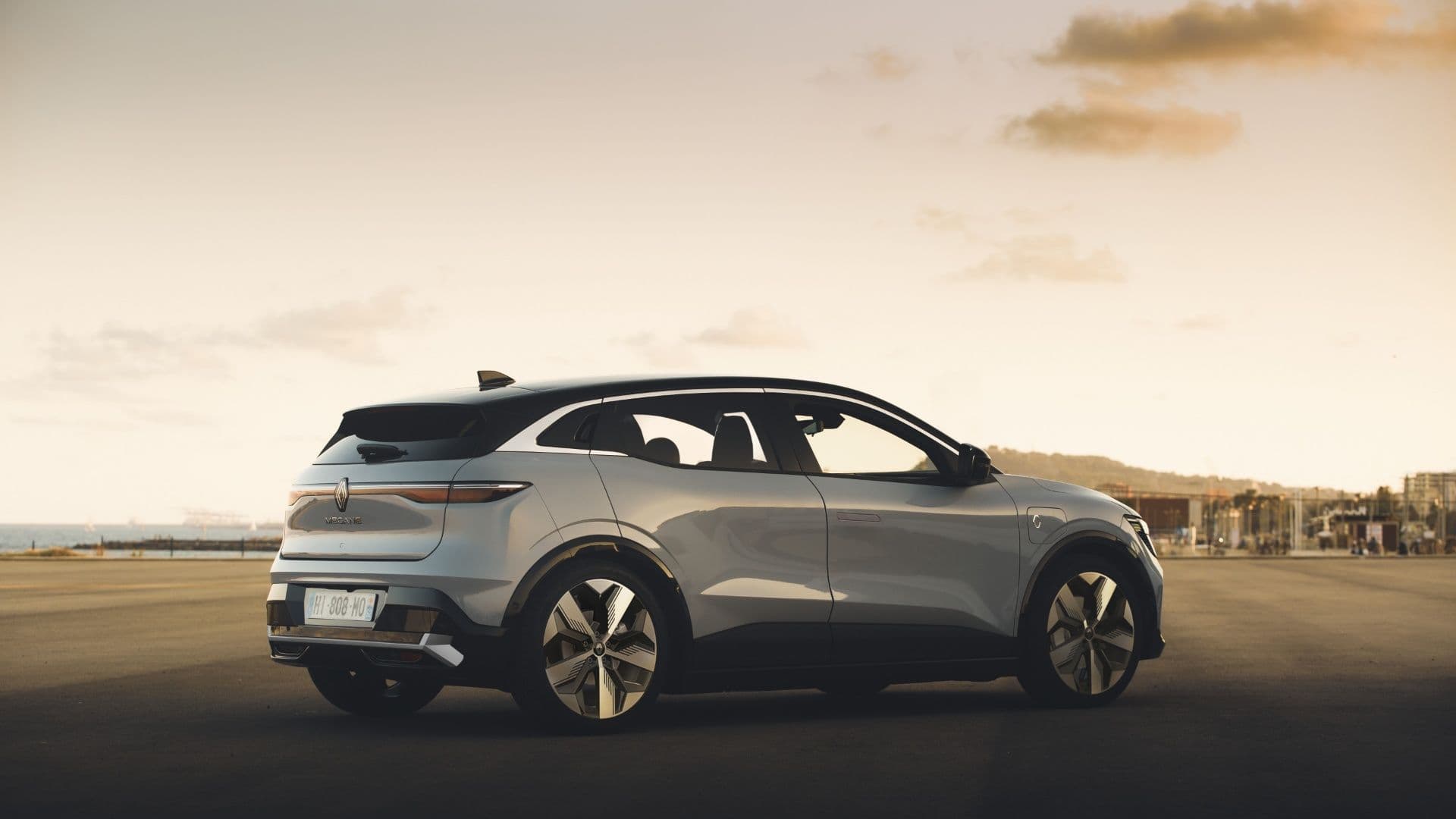 2024 Renault Megane E-Tech in grey side view parked 2024 Renault Megane E-Tech in grey side view parked