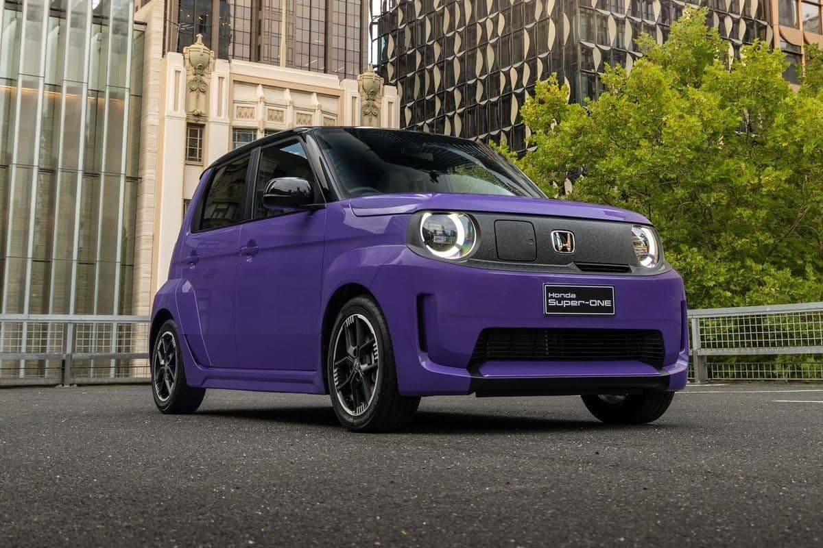 Purple Honda Super-One electric hatchback parked on an urban street in Australia Purple Honda Super-One electric hatchback parked on an urban street in Australia