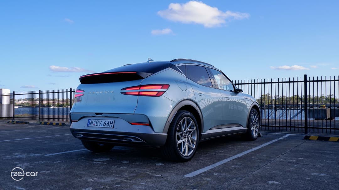 Genesis GV60 AWD in sunset rear with tail lights on Genesis GV60 AWD in sunset rear with tail lights on