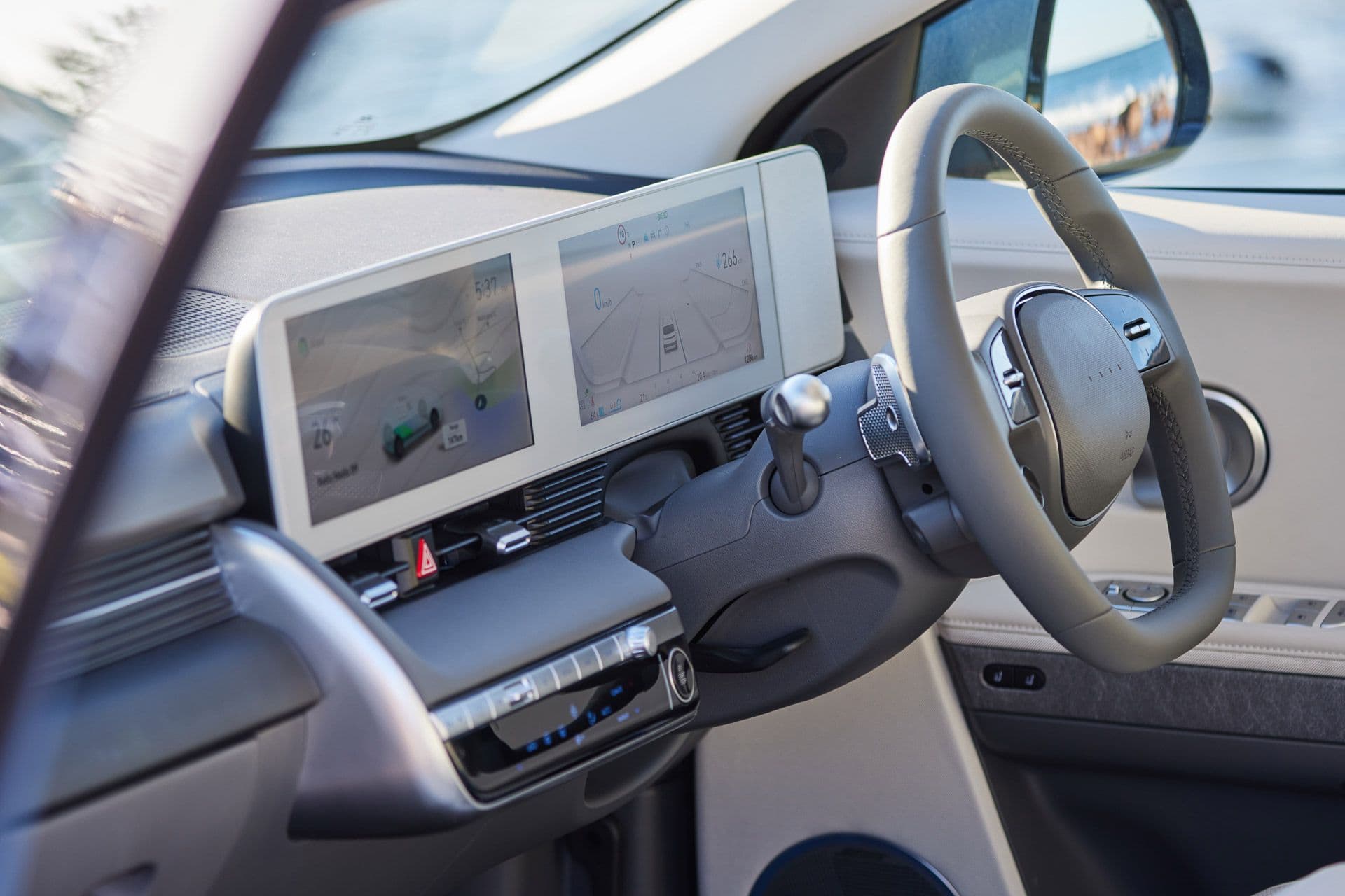 Hyundai Ioniq 5 white interior with touchscreen and steering wheel Hyundai Ioniq 5 white interior with touchscreen and steering wheel