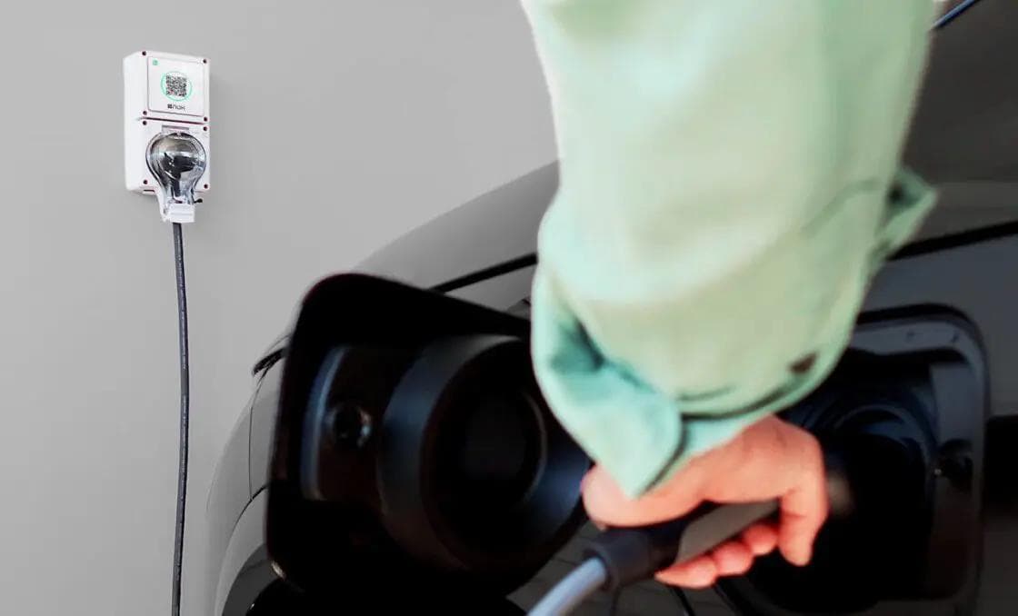 Electric vehicle charging at home with wall-mounted charger Electric vehicle charging at home with wall-mounted charger