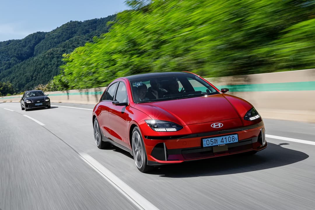 Red Hyundai Ioniq 6 driving Red Hyundai Ioniq 6 driving