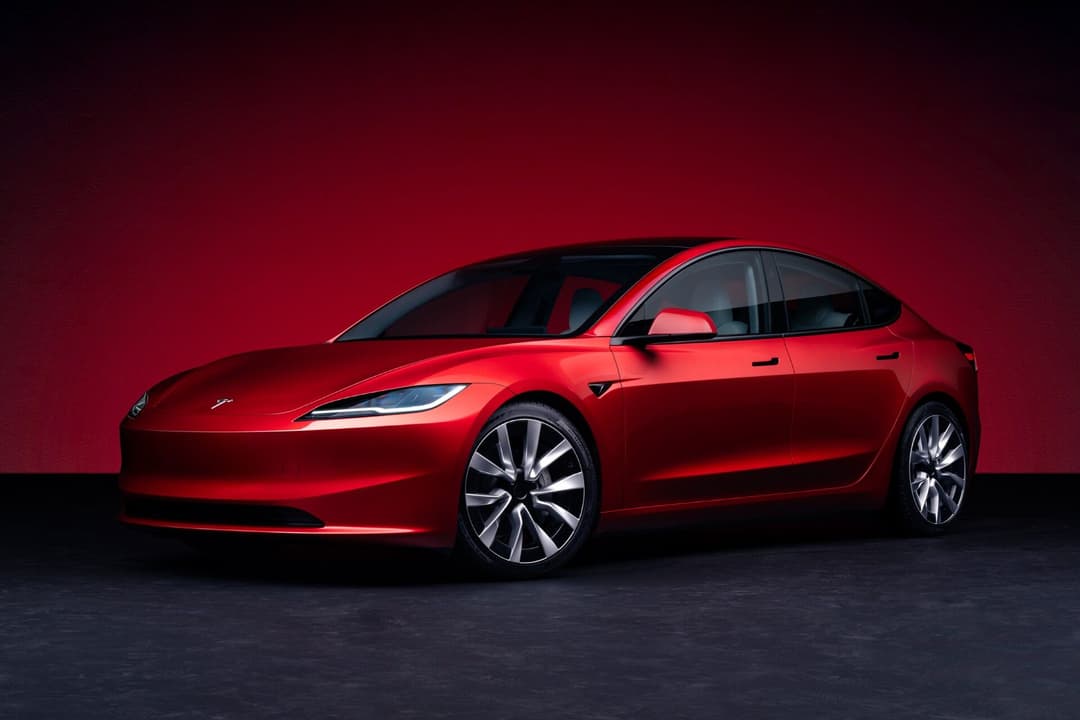 Tesla Model 3 three quarter view parked Tesla Model 3 three quarter view parked