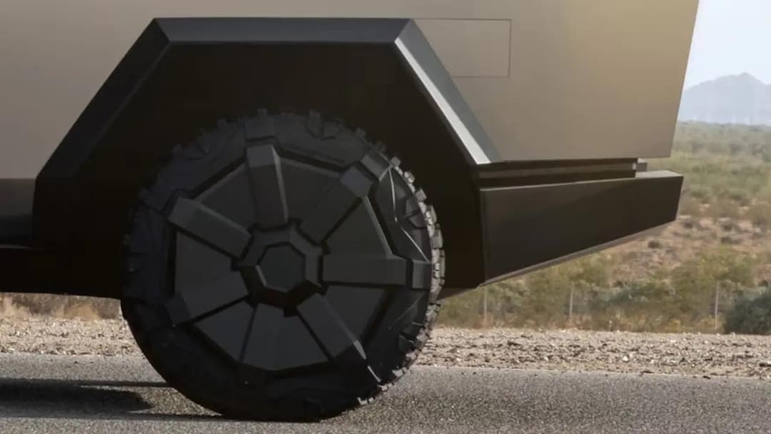 Tesla Cybertruck rear tire zoomed in at desert Tesla Cybertruck rear tire zoomed in at desert