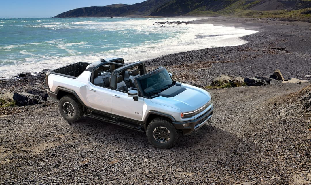 GMC Hummer EV truck offroad beside coastline GMC Hummer EV truck offroad beside coastline