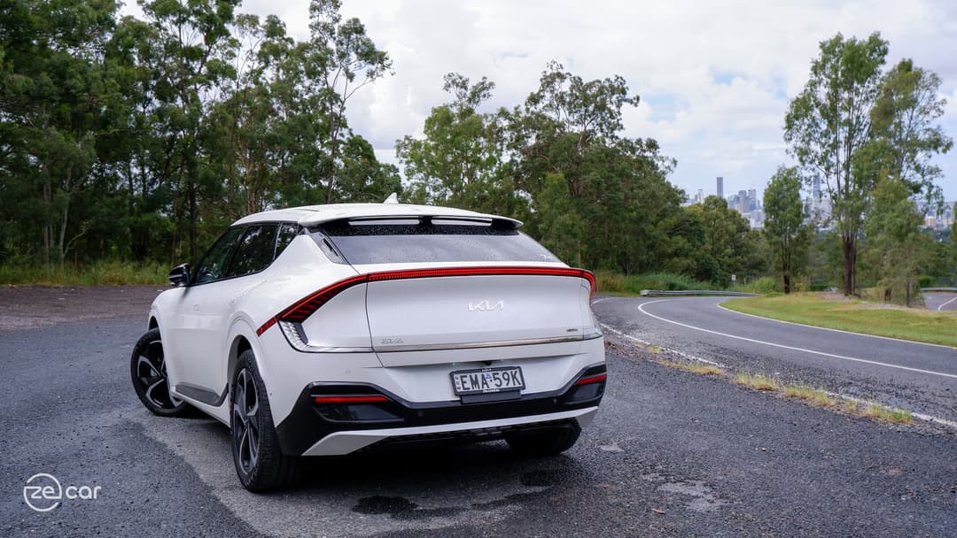 White Kia EV6 GT-Line rear on mountain road White Kia EV6 GT-Line rear on mountain road