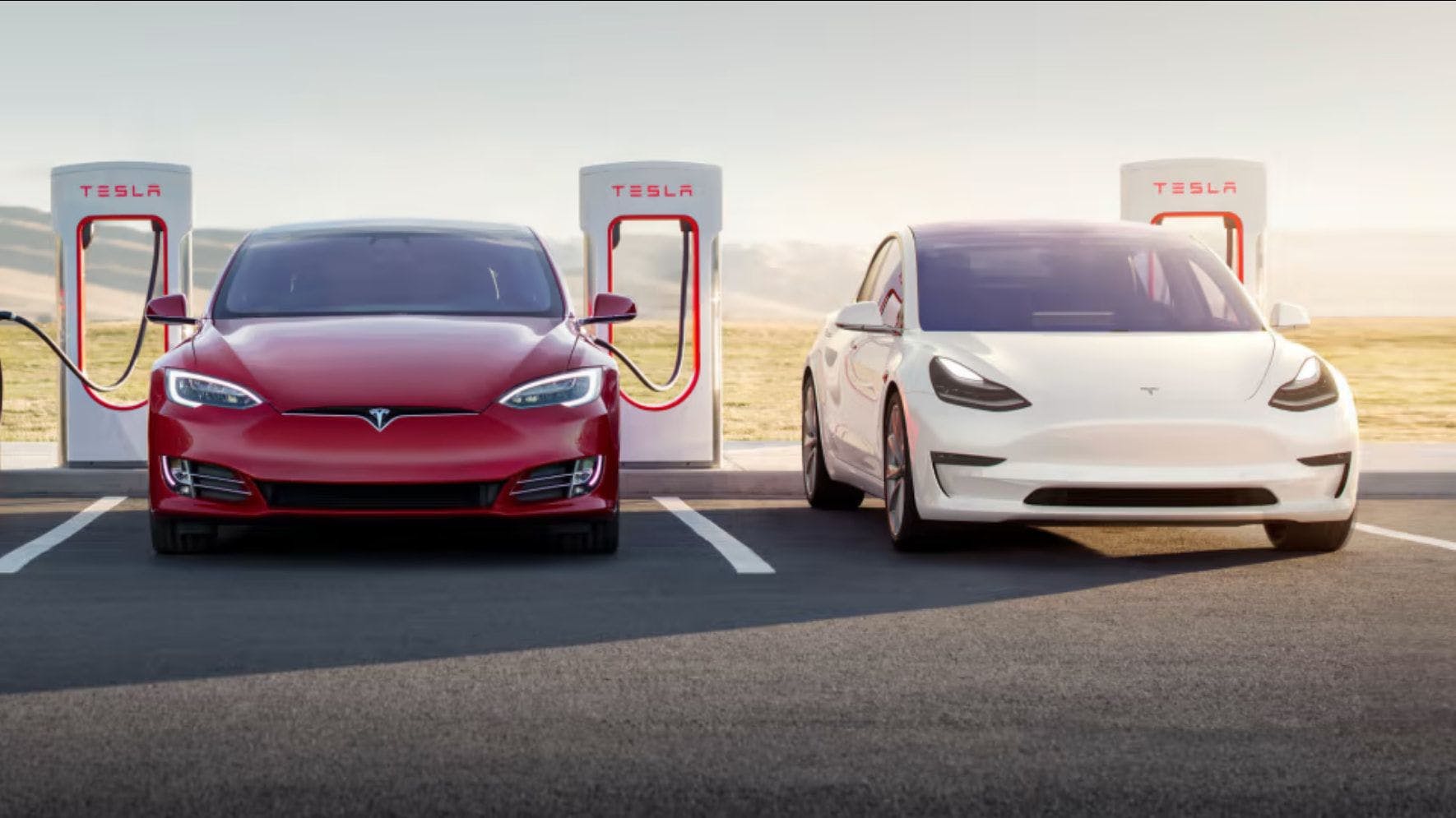 Tesla model 3 charging at supercharger